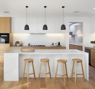 brown wooden seat beside white wooden table