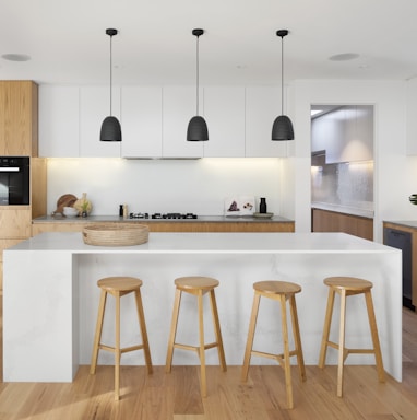 brown wooden seat beside white wooden table