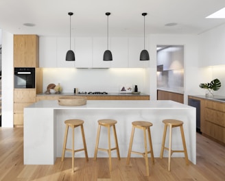 brown wooden seat beside white wooden table