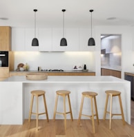 brown wooden seat beside white wooden table