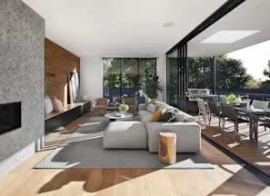 gray sectional couch beside brown wooden table