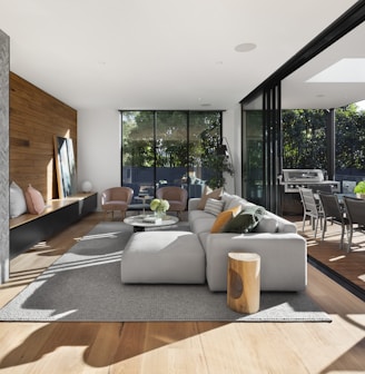 gray sectional couch beside brown wooden table