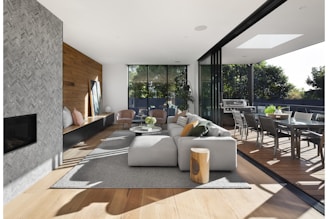 gray sectional couch beside brown wooden table