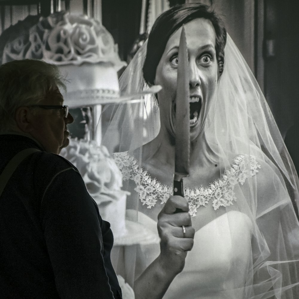 woman in white wedding dress holding a bouquet of flowers