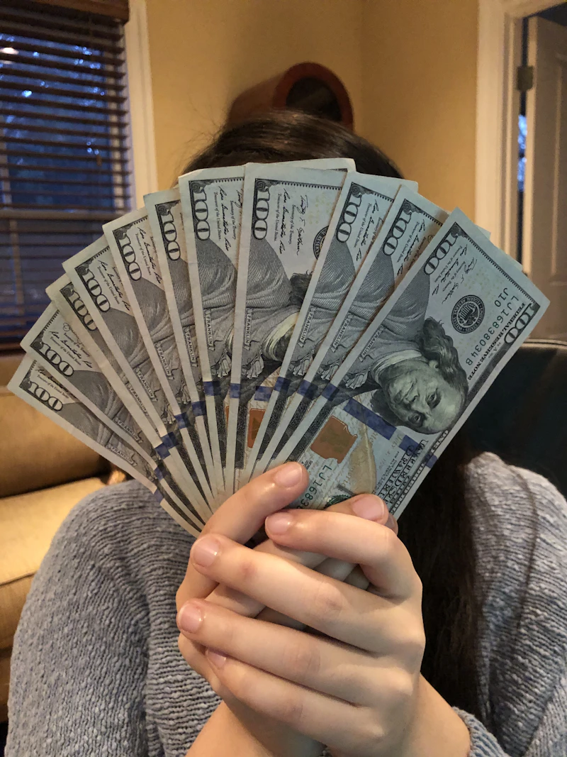 Person holding cash money