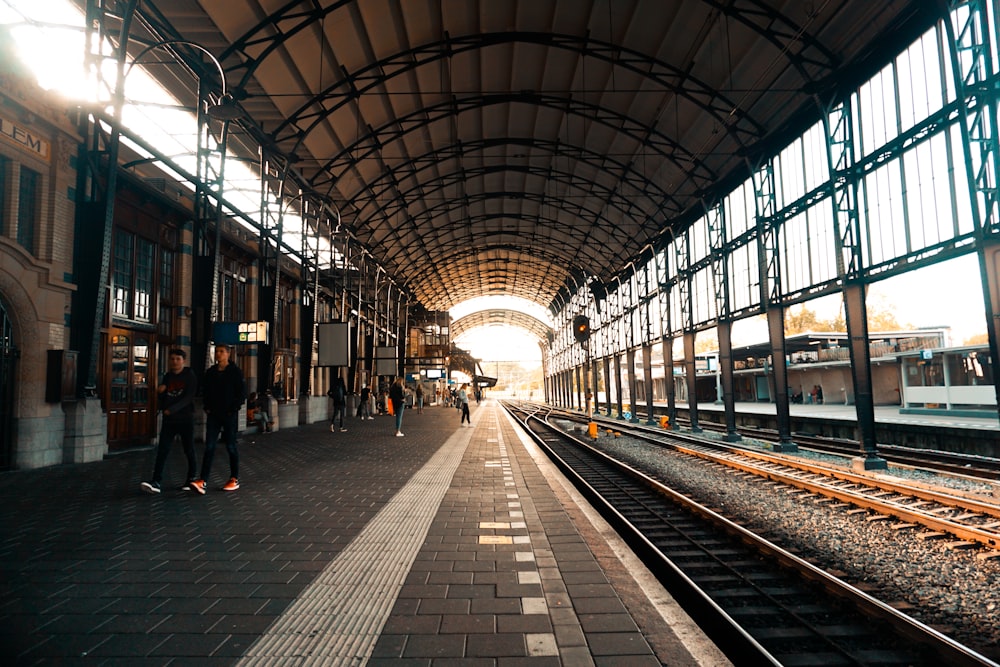 people walking on train station during daytime