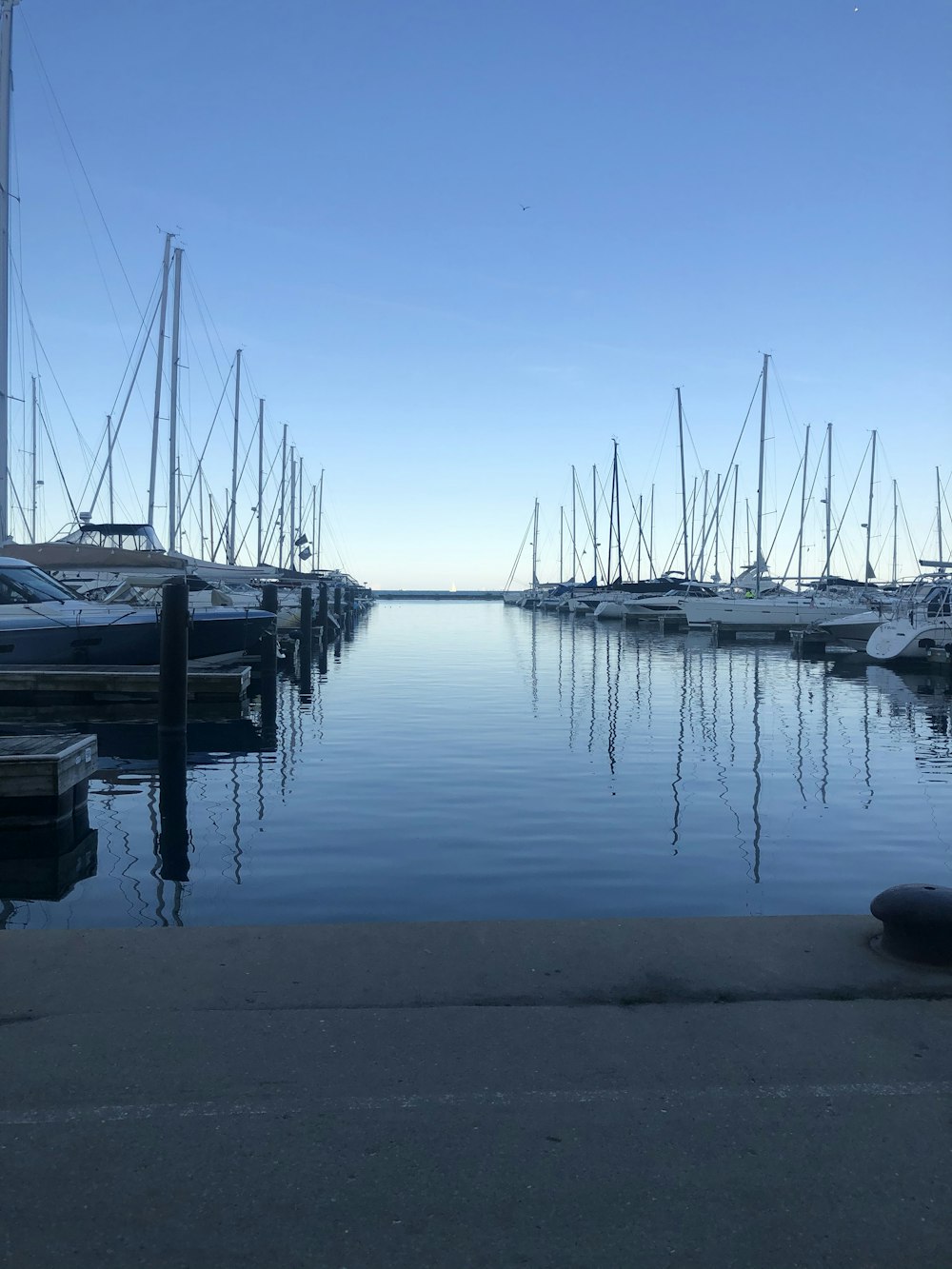 white boats on dock during daytime