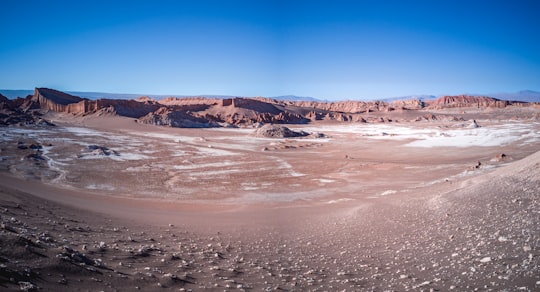 brown and white mountains under blue sky during daytime in San Pedro de Atacama Chile