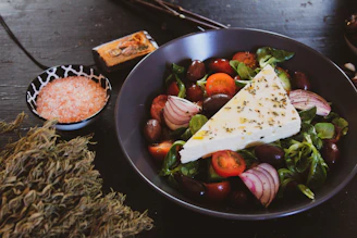 black ceramic round plate with food