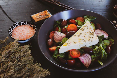 black ceramic round plate with food
