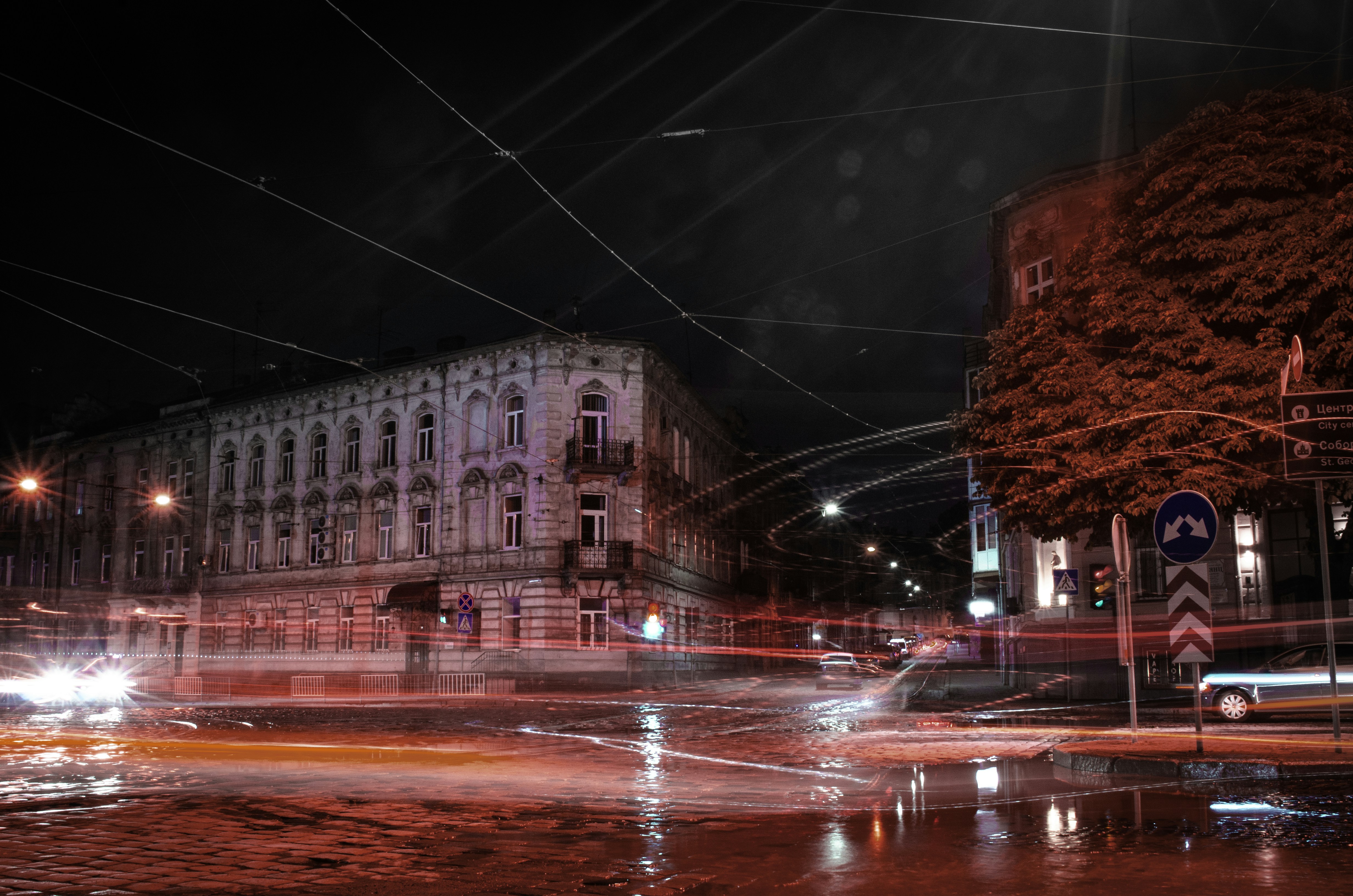 brown concrete building near road during night time, 