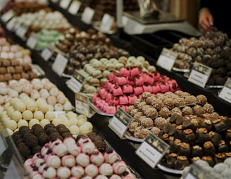 assorted color of round fruits on display
