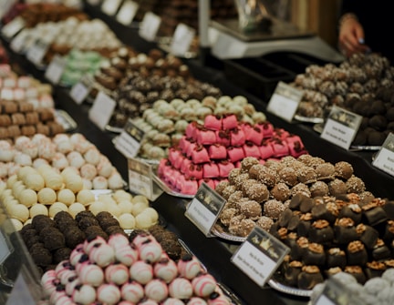 assorted color of round fruits on display