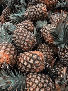 green and brown pineapple fruits
