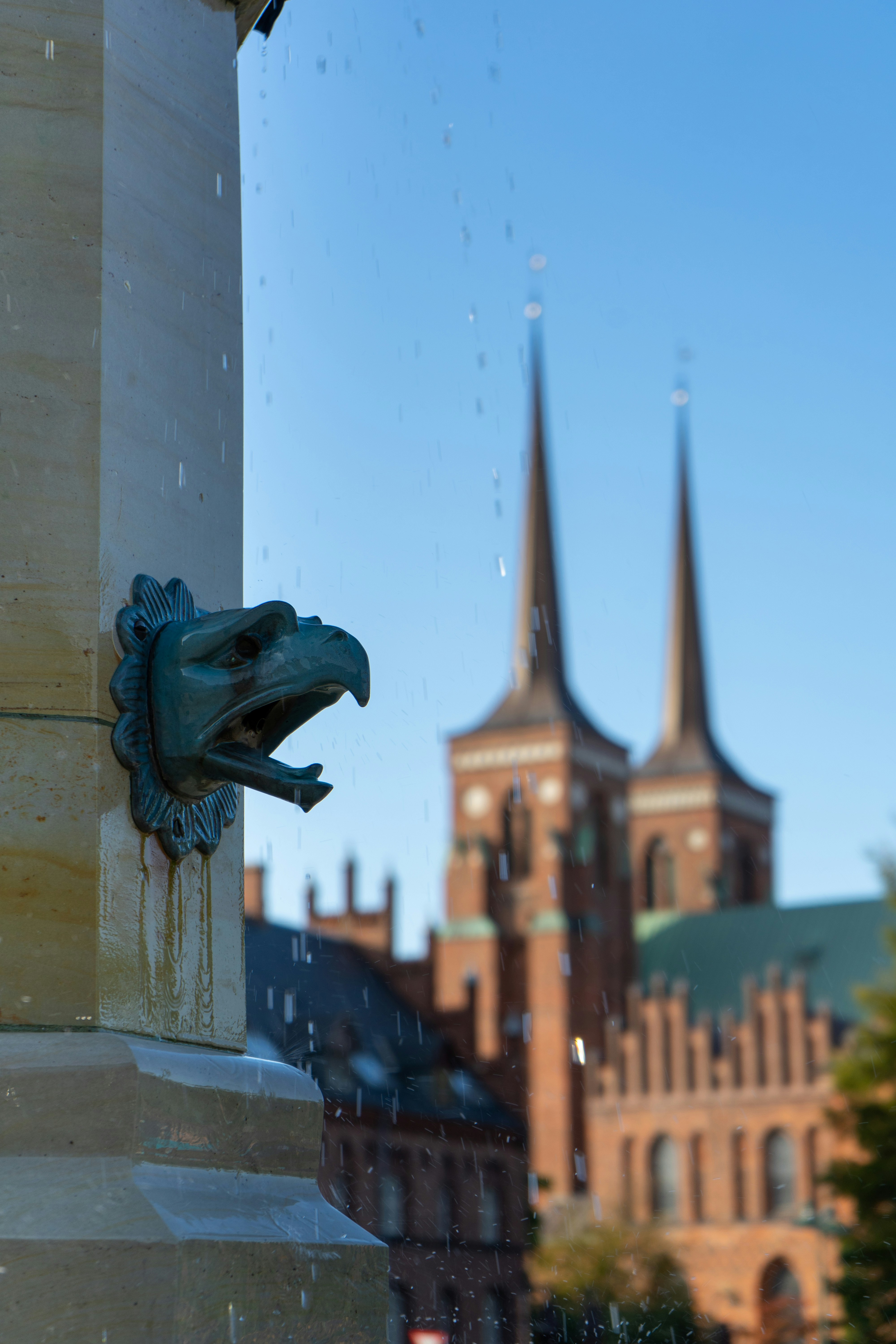 blue dragon statue near white concrete building during daytime
