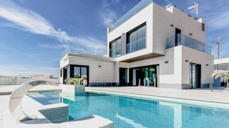 white concrete building under blue sky during daytime