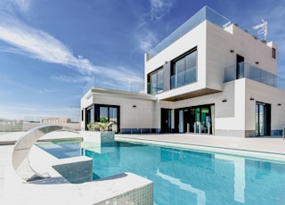 white concrete building under blue sky during daytime