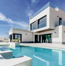 white concrete building under blue sky during daytime