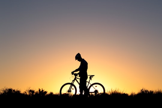 silhouette of man riding bicycle during sunset in Esfahan Iran