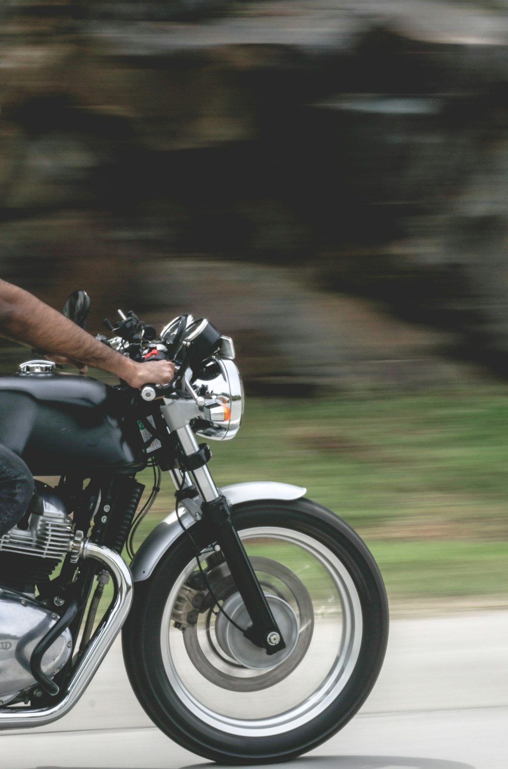 person riding on black motorcycle during daytime