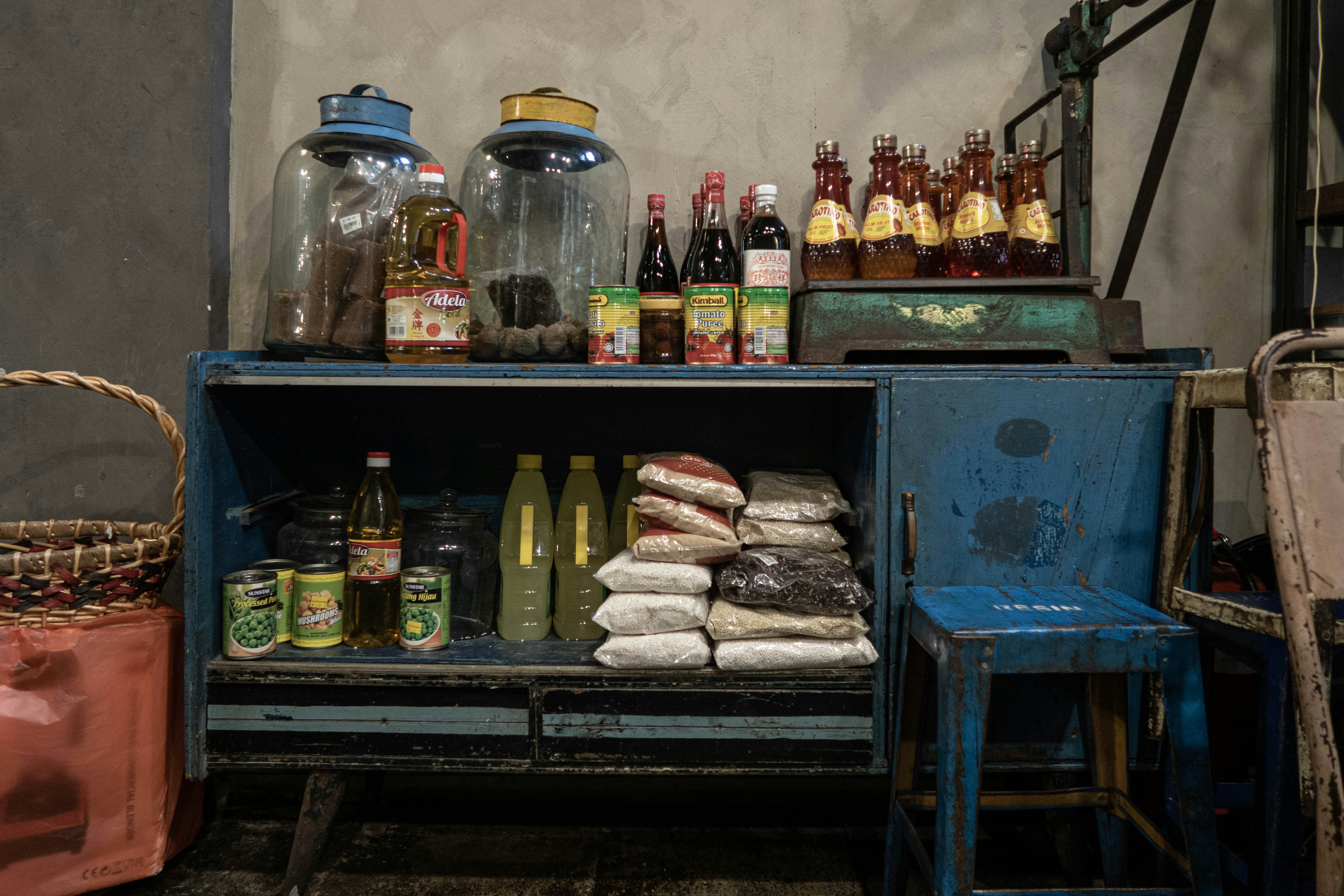 clear glass jars on blue wooden shelf, Cooking product on an old shelf.