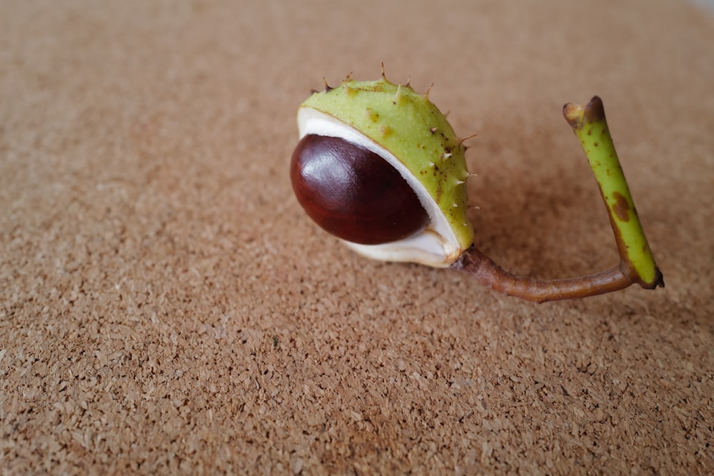 green fruit on brown textile