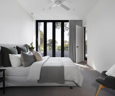 white bed linen on bed