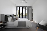white bed linen on bed