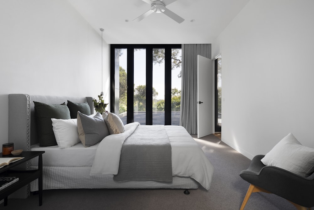 white bed linen on bed