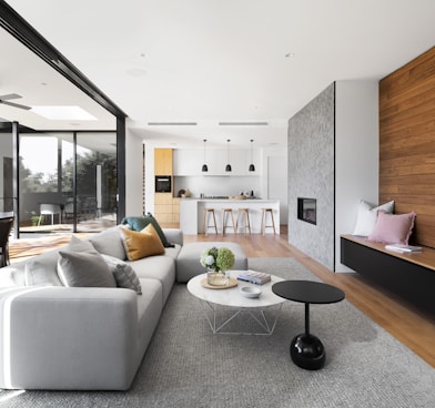 white couch beside brown wooden table