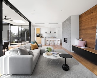 white couch beside brown wooden table