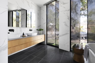 white ceramic sink near white framed glass window