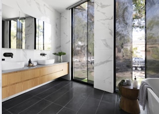 white ceramic sink near white framed glass window