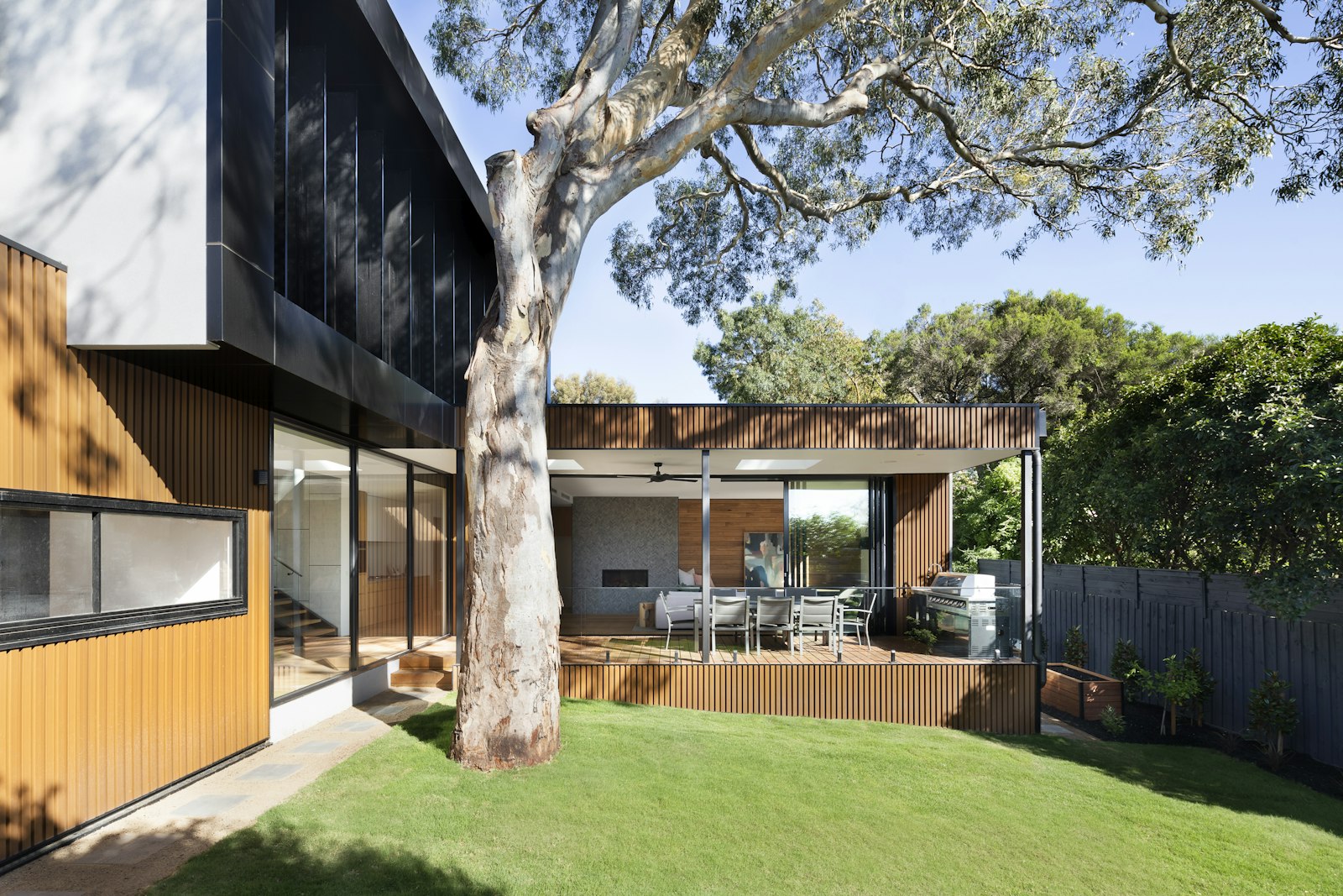 Modern farmhouse exterior at dusk