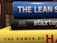 A stack of three books with colorful spines. The top book is blue with the title 'THE LEAN S'. The middle book has a black cover with the word 'startup' written on it and authors listed underneath. The bottom book is yellow, partially showing the title 'THE POWER OF H'. The books are stacked horizontally in a close-up view.