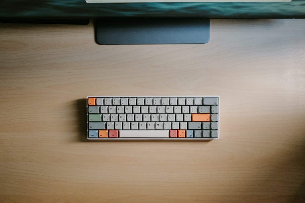 apple keyboard on brown wooden table