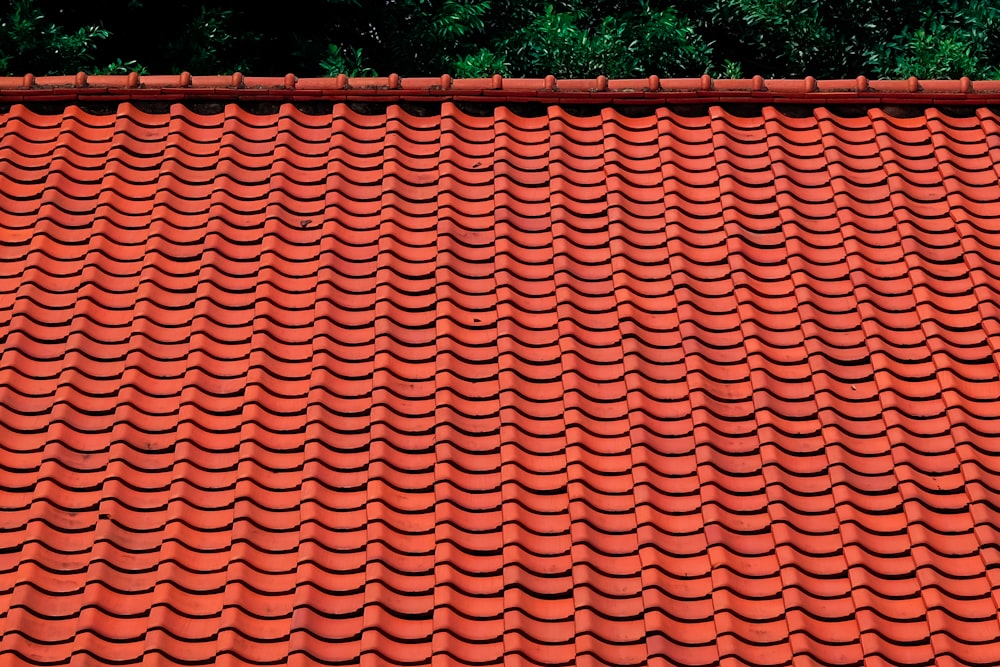 brown roof tiles near green trees during daytime