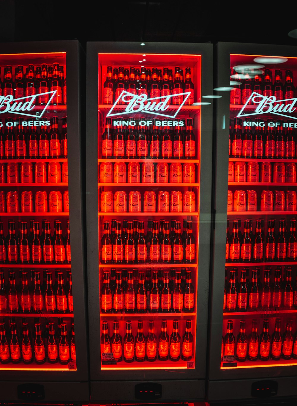 red and white coca cola bottles