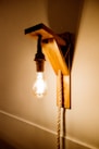 white pendant lamp turned on near white wall