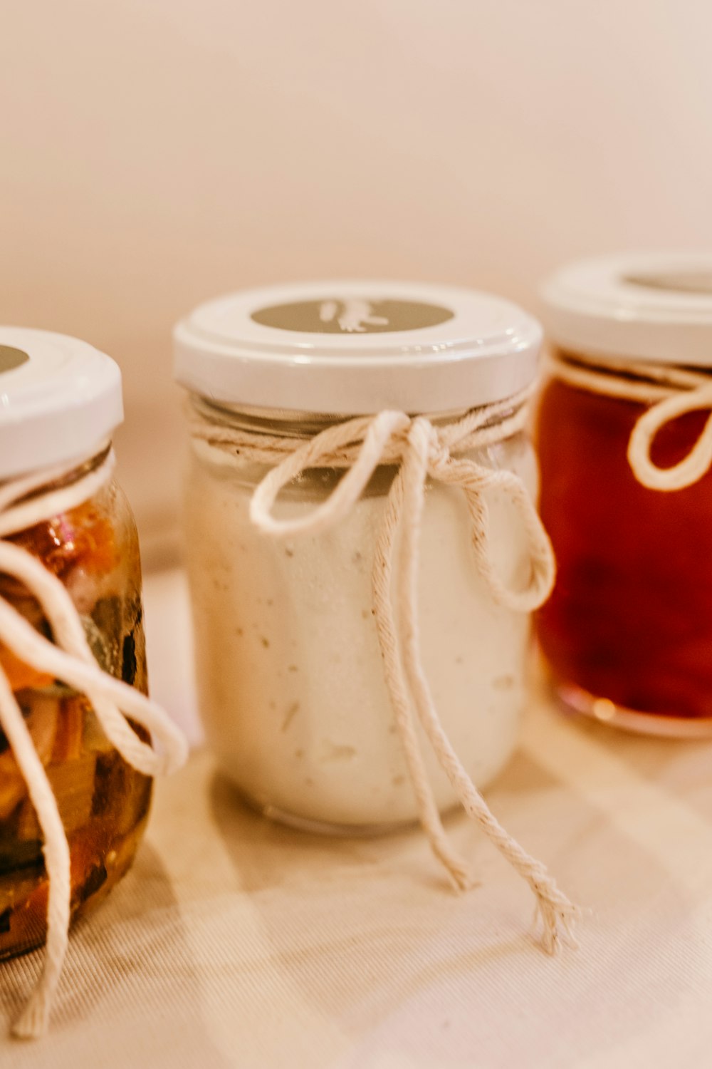 white and brown glass jars