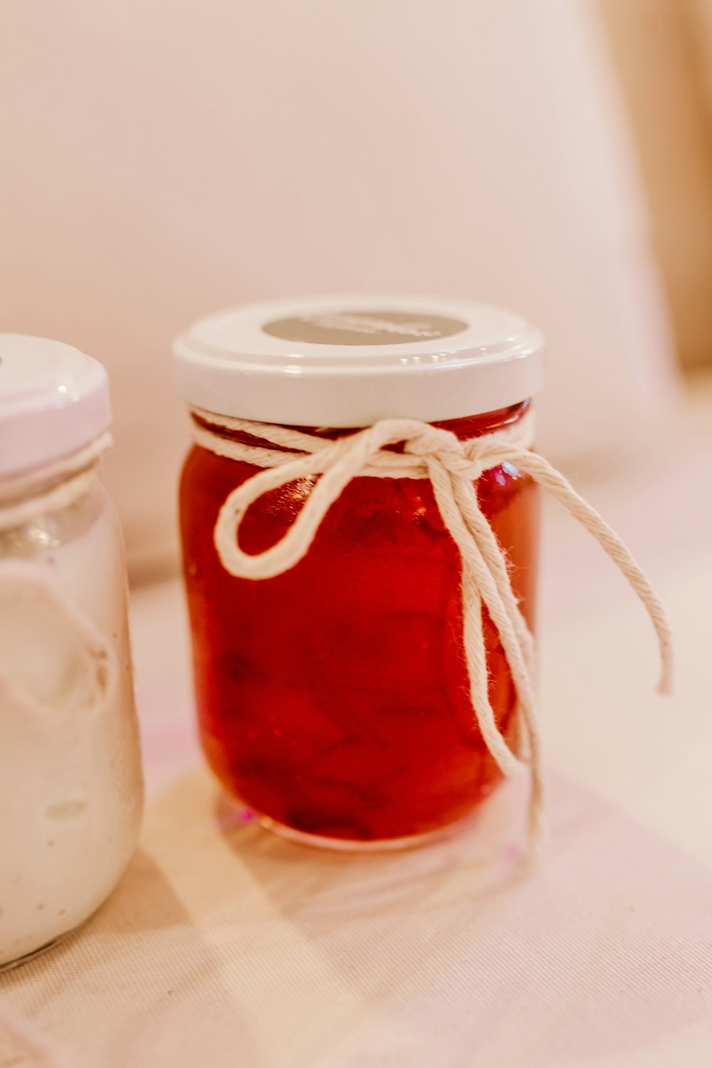 clear glass jar with red liquid