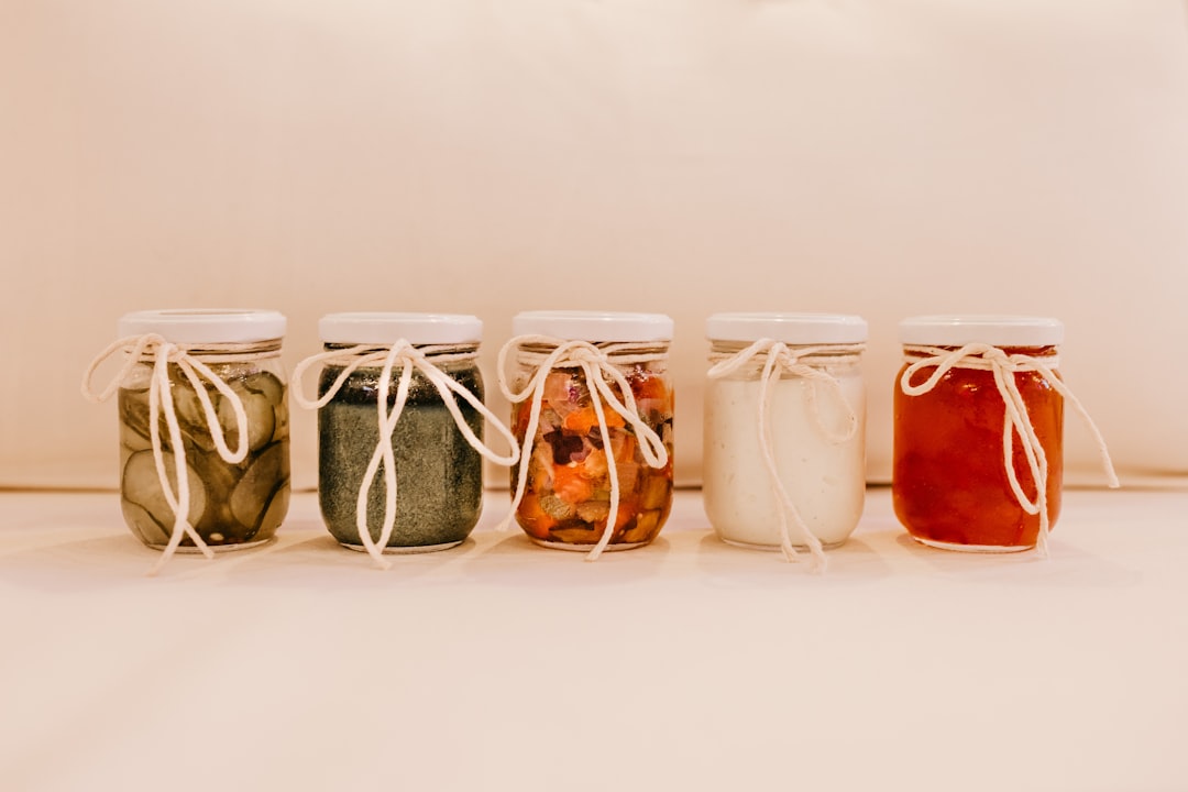 3 clear glass jars with brown liquid inside