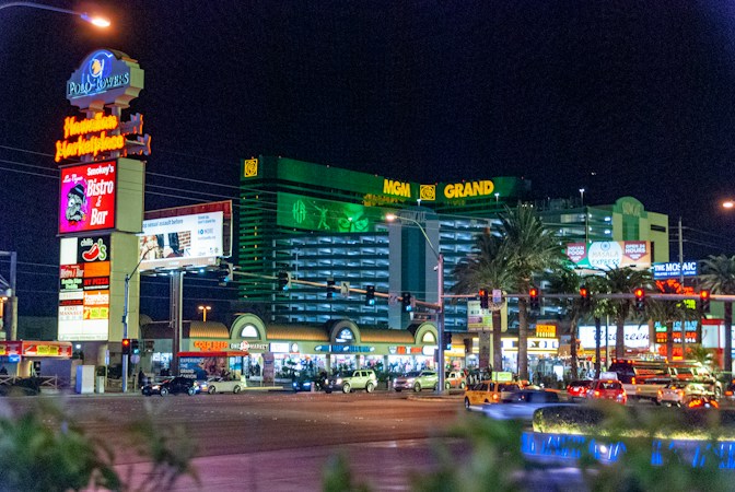 Buildings and parked cars at night in downtown Las Vegas, near the Fremont East district where new apartments are planned