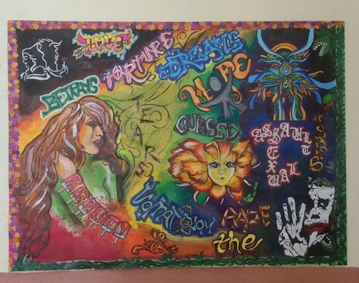 A vibrant graffiti-style artwork filled with various words and phrases such as 'love', 'fear', 'cursed', and 'hope'. It features a large illustration of a woman, abstract patterns, and a striking flower with a face. The background is a blend of different colors and artistic fonts.