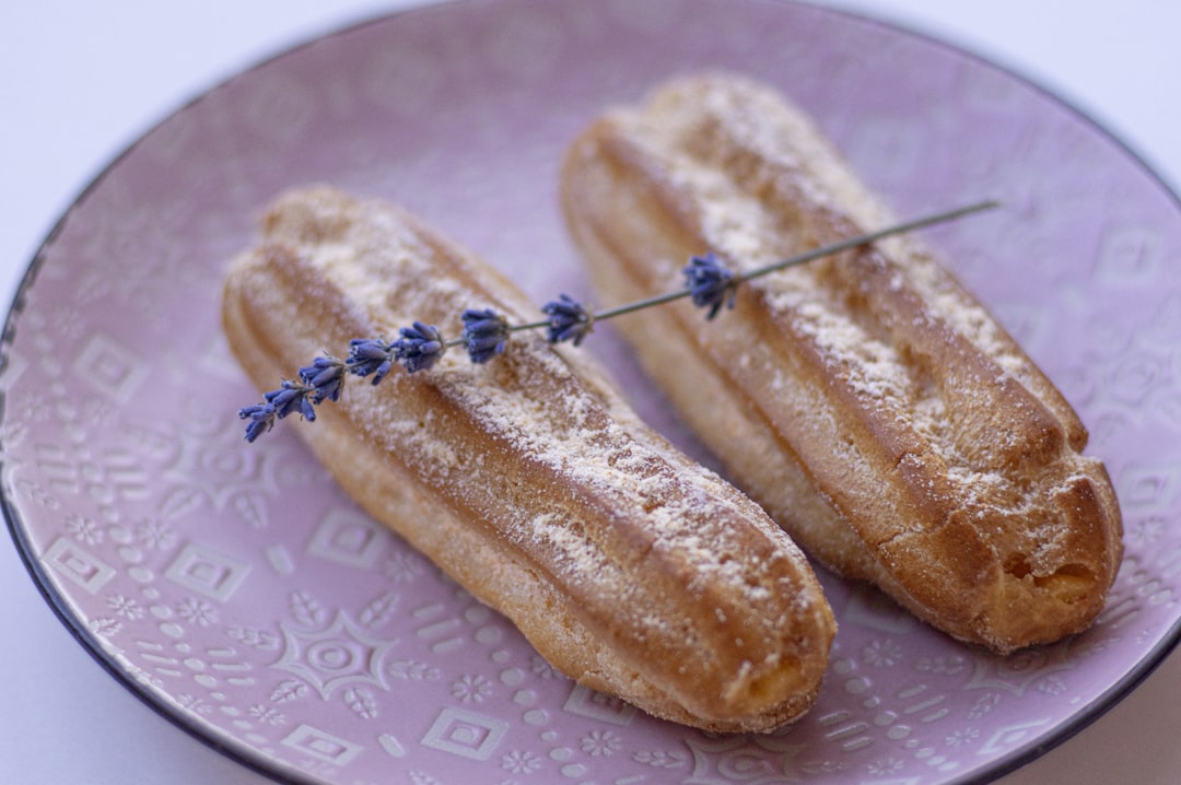 2 bread on white and blue ceramic plate,