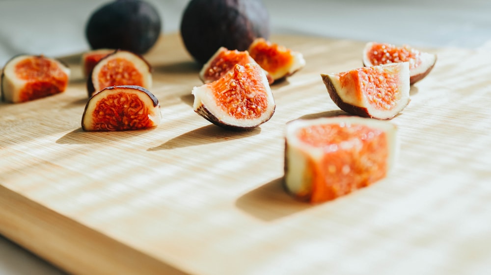 sliced of tomato on white wooden table