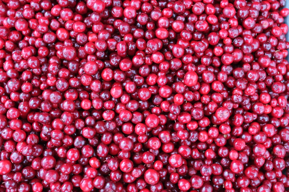 red round fruits on white surface