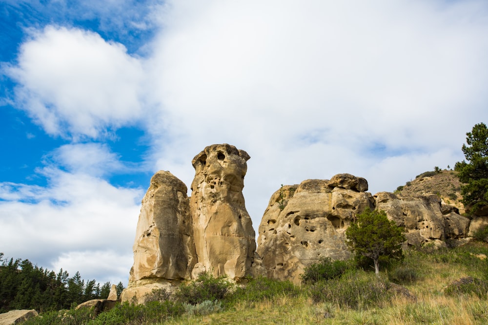 brown rock formation under blue sky during daytime