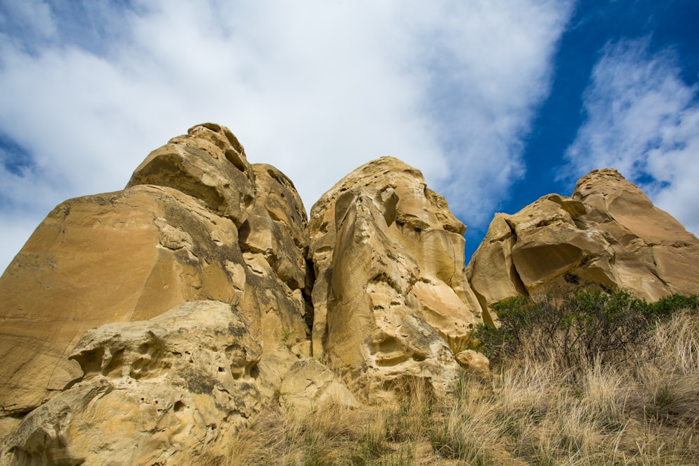 brown rock formation under blue sky during daytime