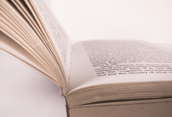 Close-up shot of open books with rich textures and typography.